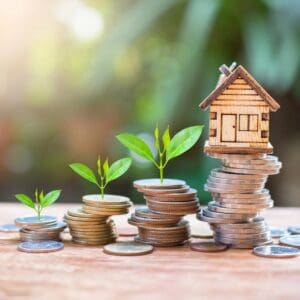 House ornament stacked on coins